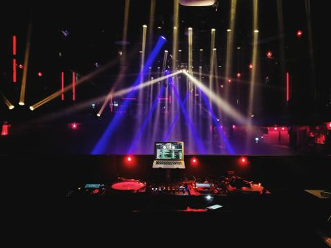 Large crowd holding up phones indoor concert live event India